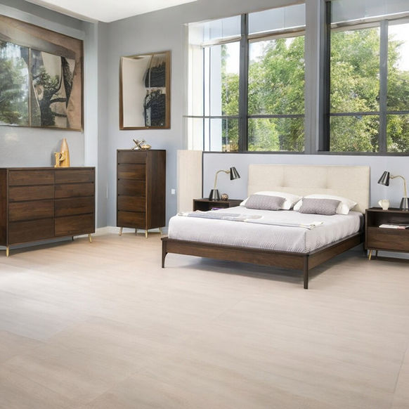 Evora Upholstered Bedroom Set in room with bed, nightstand, lingerie chest and dresser