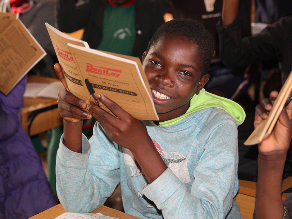 Malawian boy with a book.