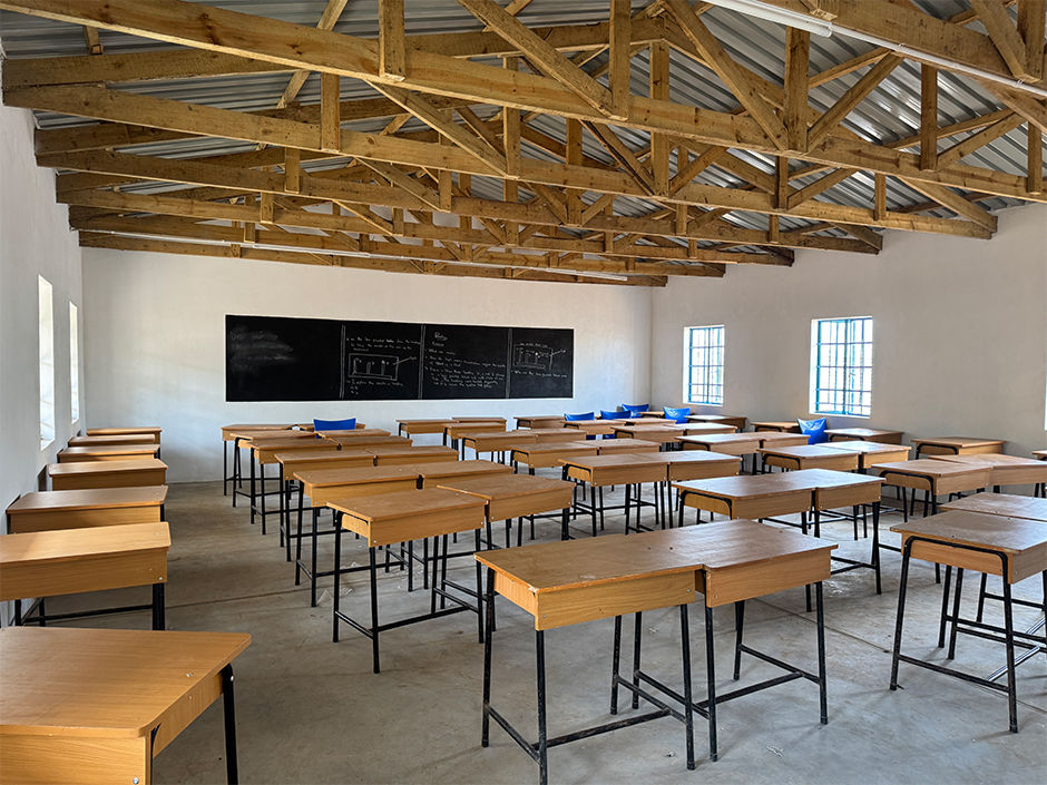 New classroom with desks and a blackboard