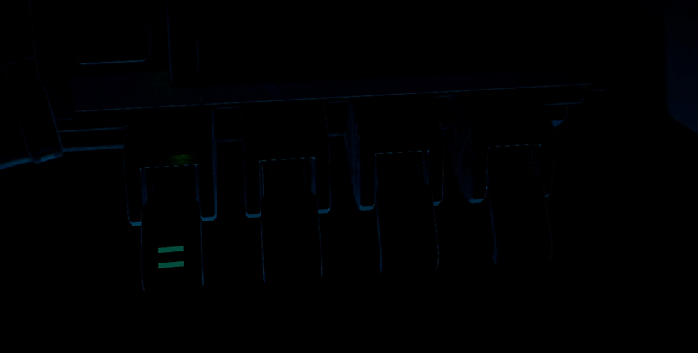 Close-up of a dark mech cockpit with faint blue edges and one key marked by two green bars, moody low light