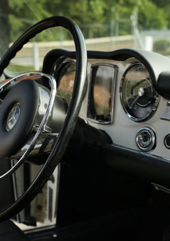 Steering wheel and cream dash of the Mercedes-Benz 280SL at Angels Touch Restoration.