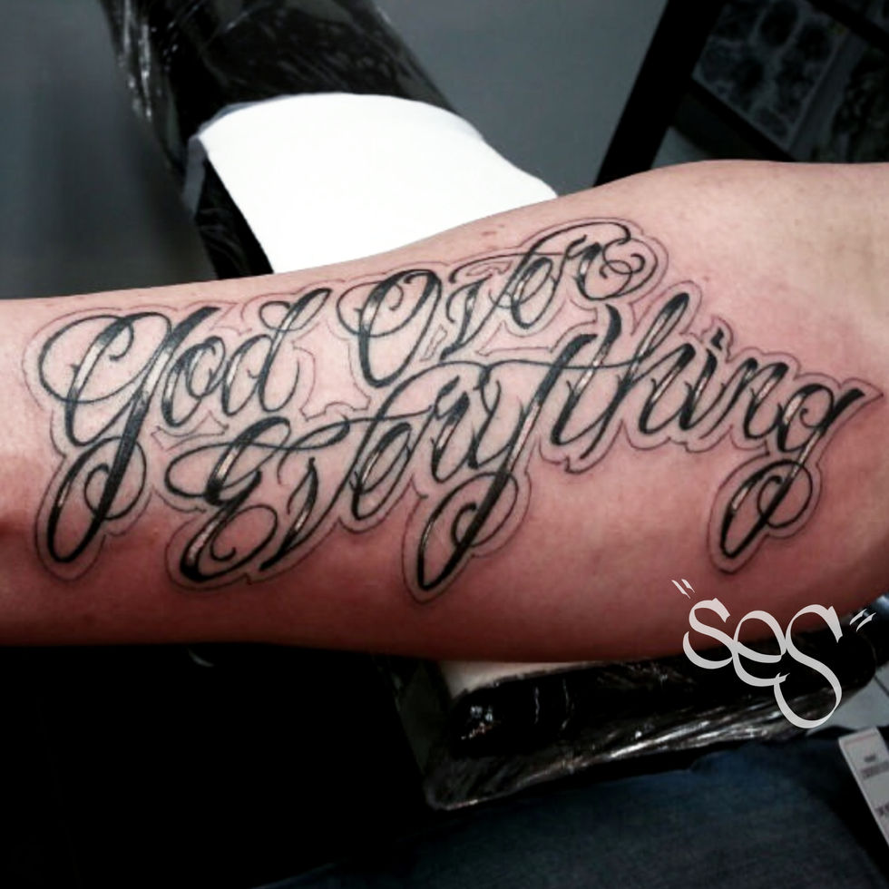 Custom Chicano style script lettering tattoo by Ses at Blackwork Tattoo Studio in Little Falls, NJ