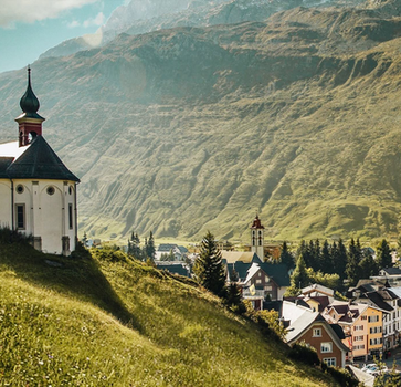 Walkway through the narrow Aare Gorge, clinging to rock walls above the turquoise Aare River.