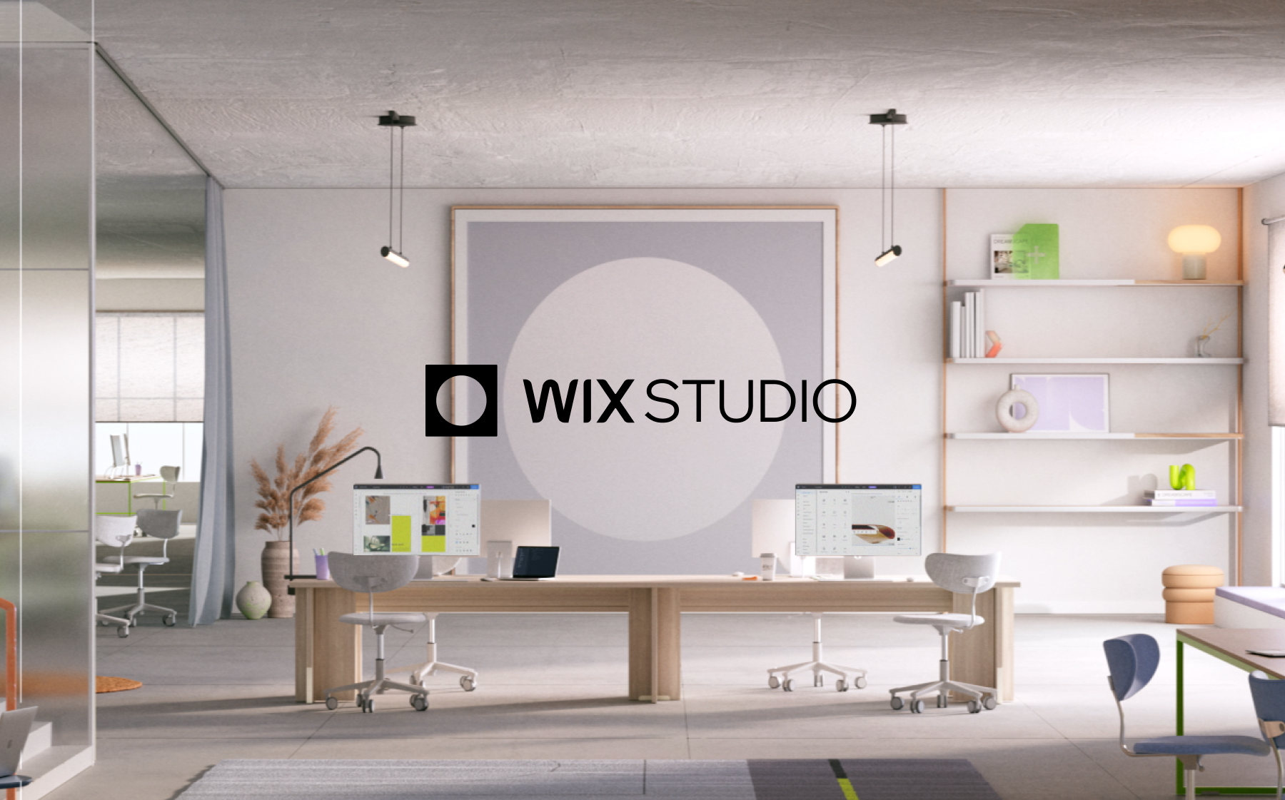 Modern office with desks, computers, and shelves. Large "Wix Studio" logo on wall. Minimalist decor, neutral tones, and bright lighting.