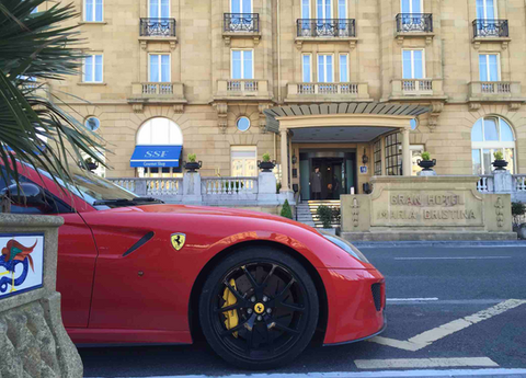 Red Ferrari parked outside the Hotel Maria Cristina in San Sebastián at the start of the Spain supercar tour.