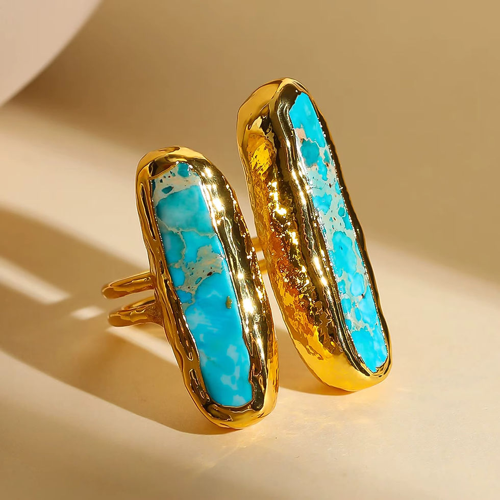 Gold ring with two elongated turquoise stones