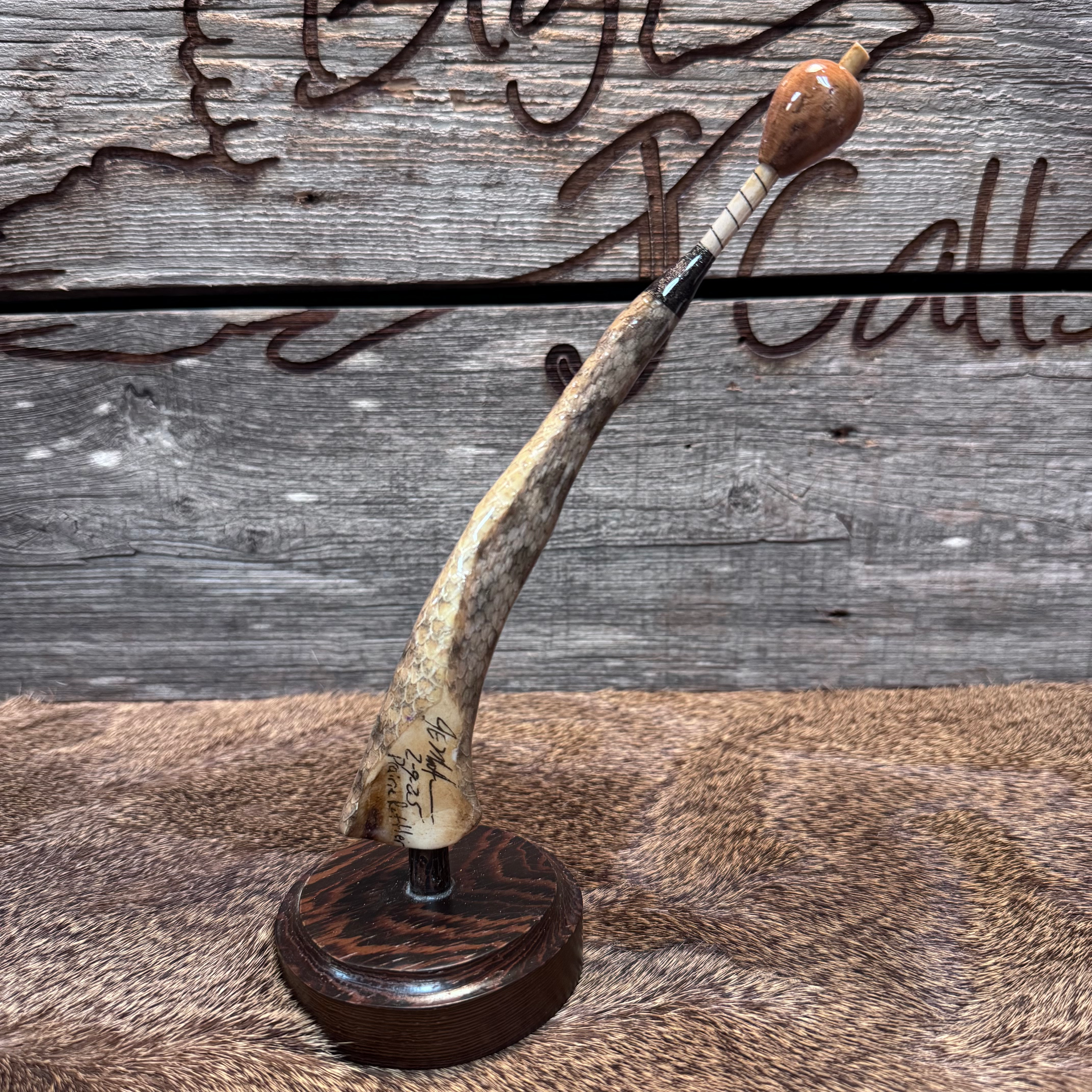 3 piece turkey wingbone call wrapped with snake skin. 