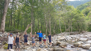Travelling along the Uono River, which flows from the Valley River Range.