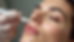 Close-up view of a dermaplaning tool gently scraping facial skin