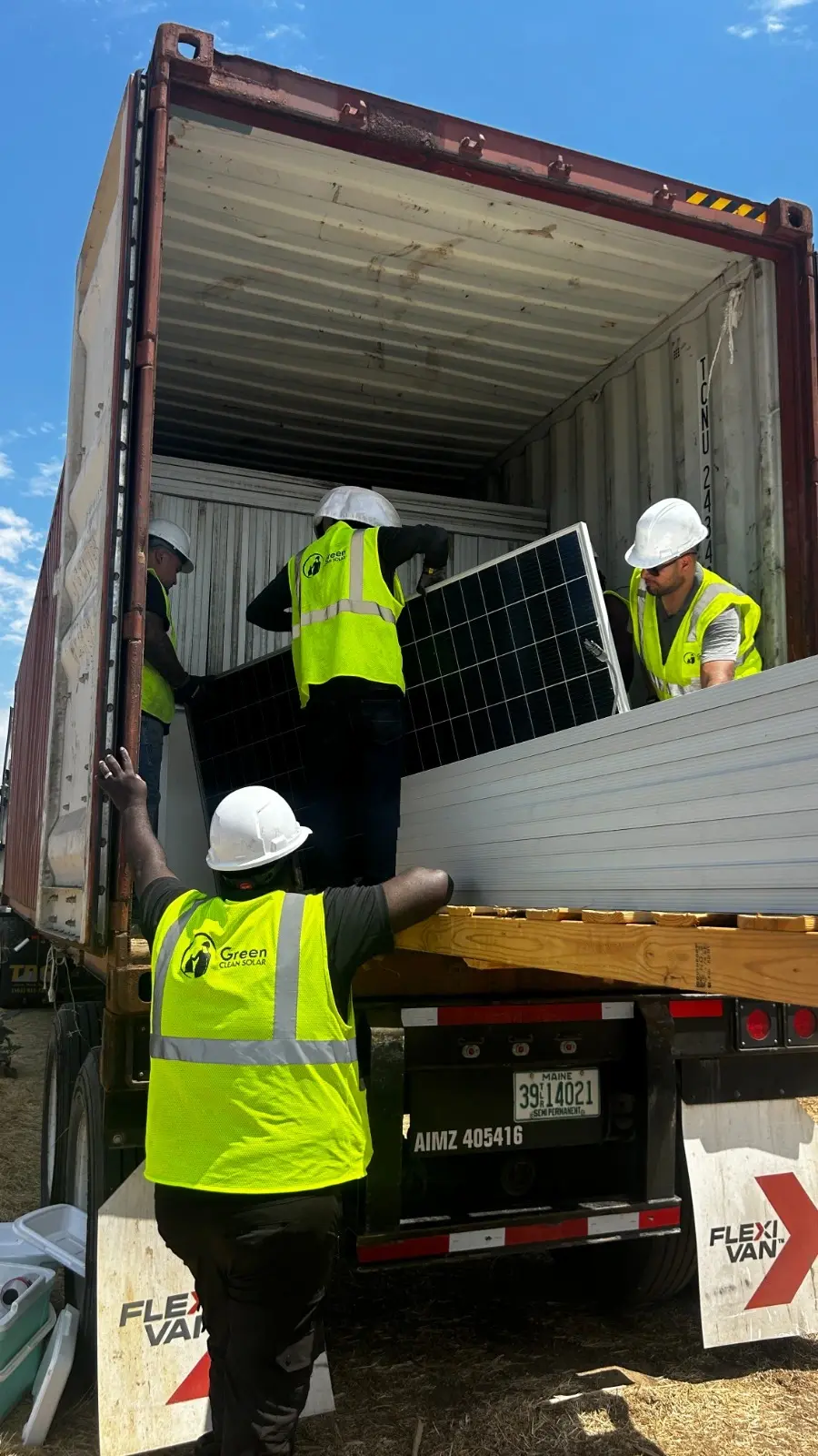 green clean workers are collecting the solar panels that needs to be recycled, and all the materials are covered with it.
