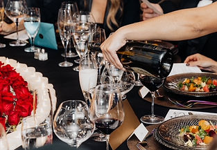 Private event guests enjoying cocktails and wine catered by S&G Private Events.