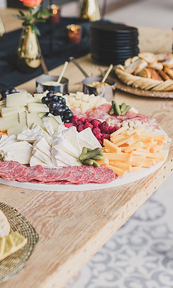 S&G Private Events luxury charcuterie buffet with cheeses, meats, and fruits.