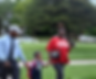 Mom and dad walking child, holding hands, and smiling