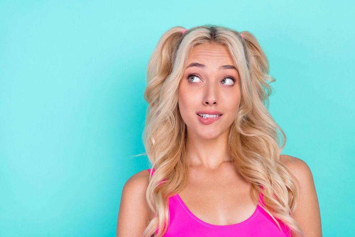 Photo of young girl curious interested look empty space think dream isolated over turquois