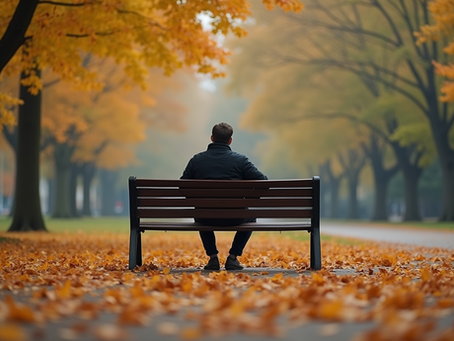 A high-achieving adult pausing to rest on a park bench in autumn