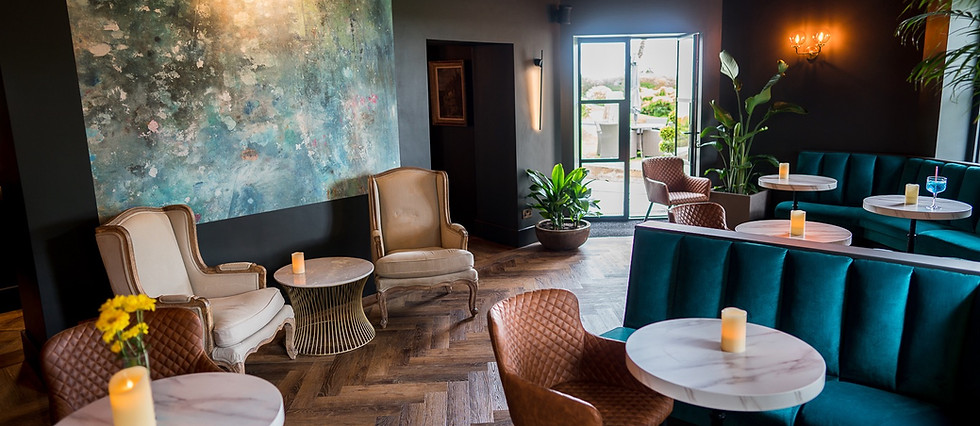 Enjoy a cocktail in the stylish and comfortable Garden Bar