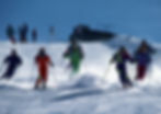 ALPY travel tips, recomends La Tzoumaz slopes as seen in the photo. With a group of skiers enjoying the La Tzoumaz Alpine ski trip