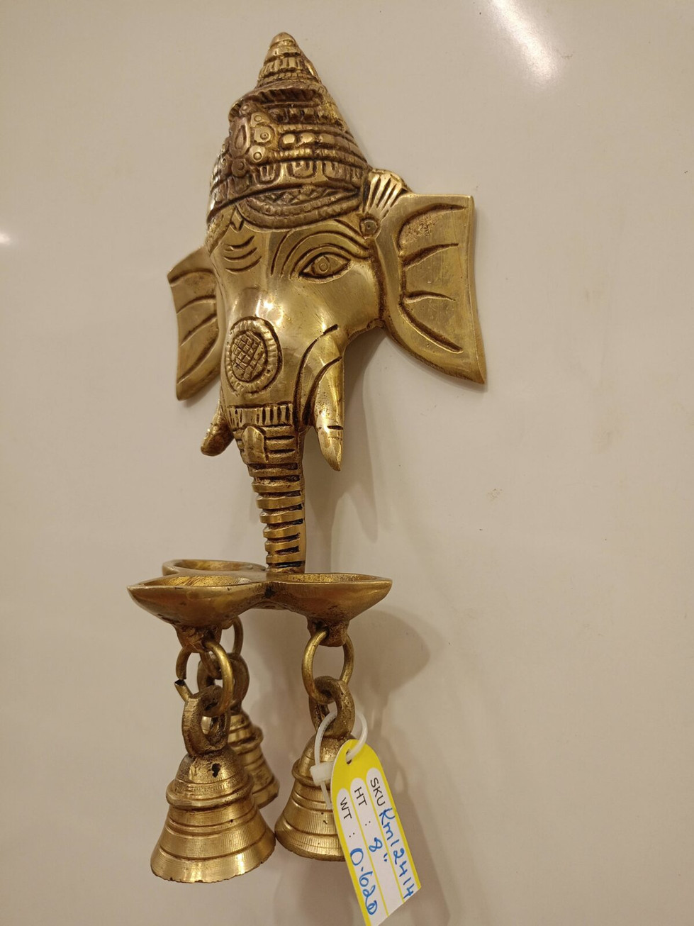 Brass Ganesha face with Diya and Bells