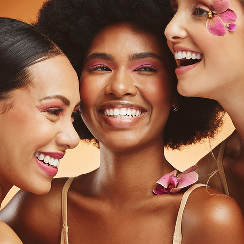 Women, beauty and flowers, makeup and diversity of models on orange studio background. Ski