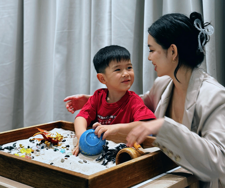 A play therapist working with a child through play