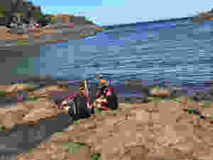 3 Kids exploring sea life and creatures with snorkel masks at Bushrangers Bay/ Bass Point/ South Coast