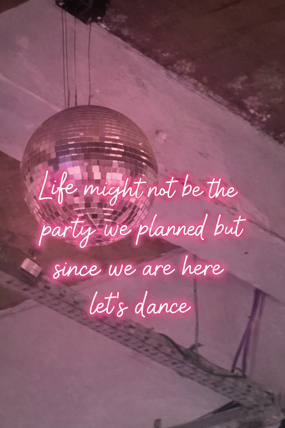 Close-up of a disco ball shining lights around a room during a dance event