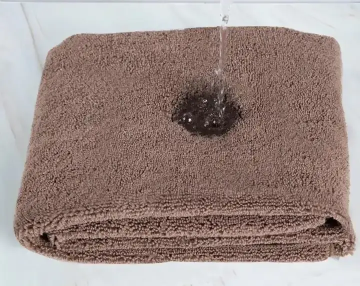Thumbnail: Showing how well the microfiber towel absorbs water