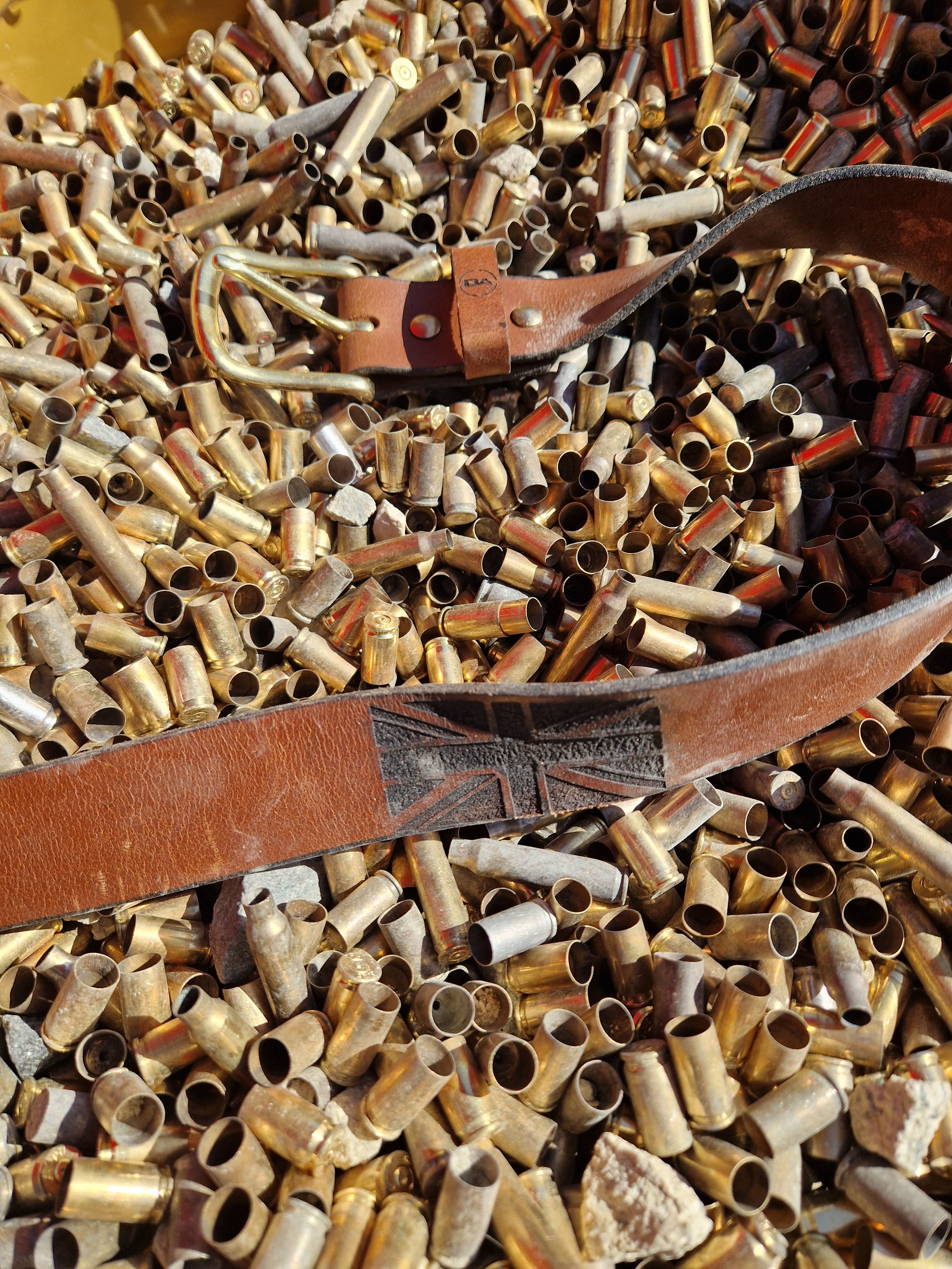 Personalisation example: a brown BlackAlpha leather belt embossed with a Union Jack.