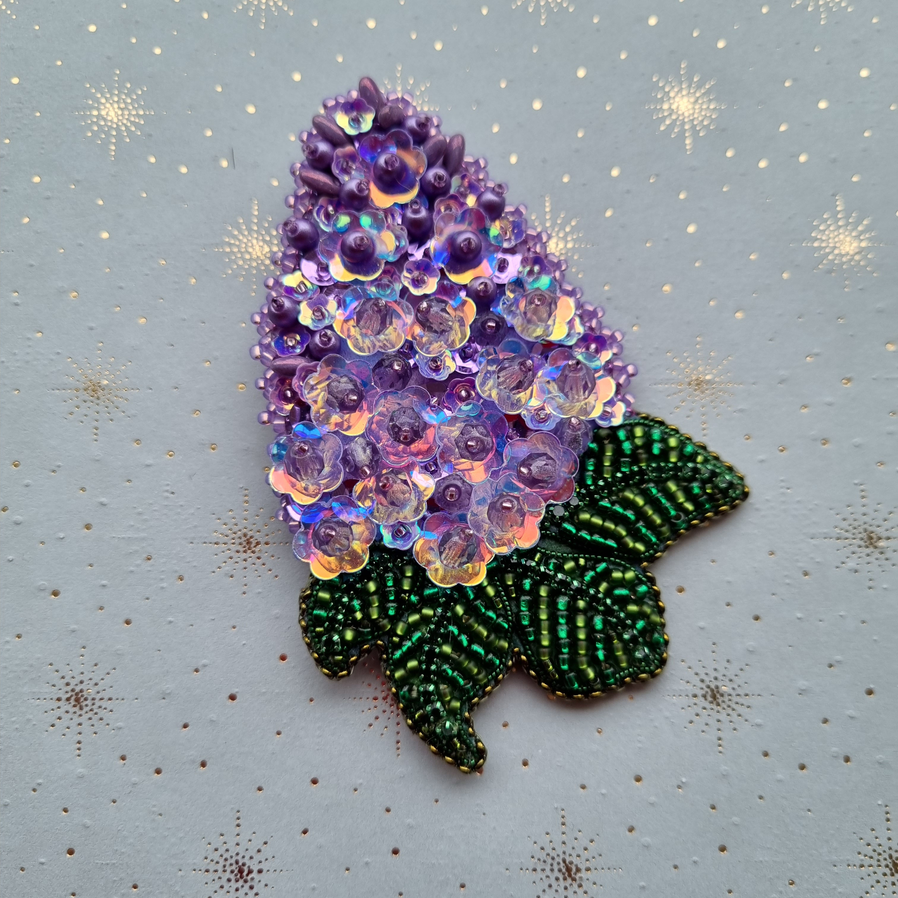 "LILAC" brooch.
