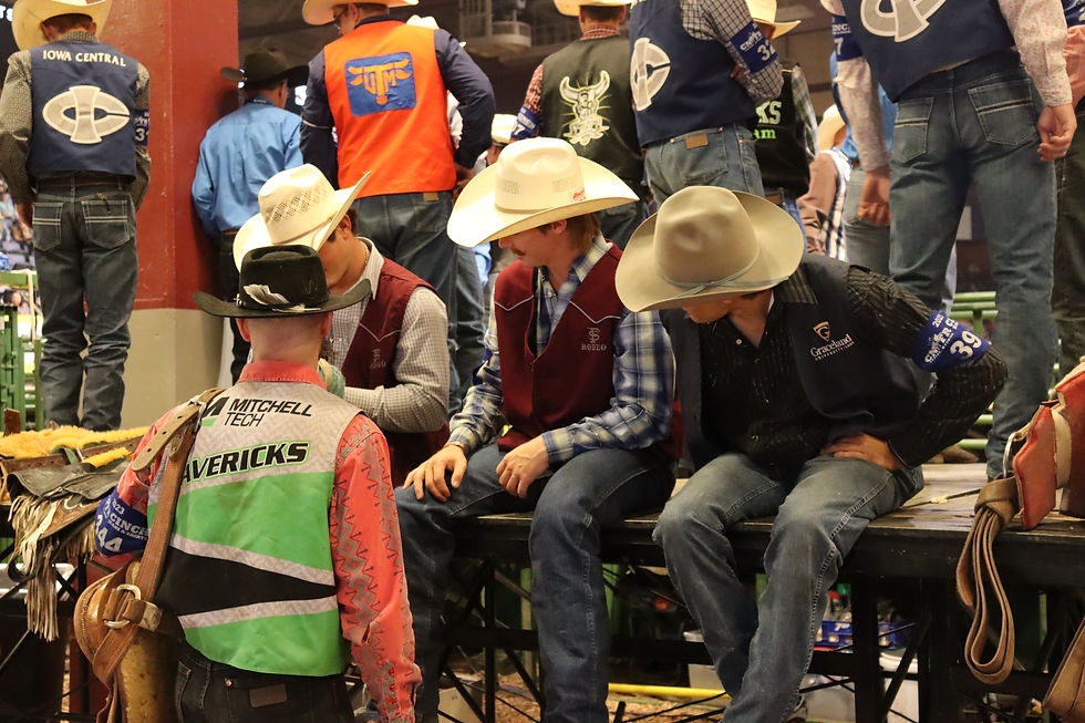 Contestants sit behind the chutes during one performance of the College National Finals Rodeo in Casper, Wyoming. College Rodeo Recruiting is not the place for comparison.