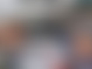 Travel writers Cookie & Keller pose at CityPASS sign at Fishermans Wharf San Francisco