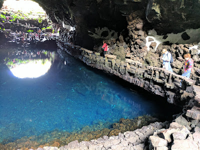 One of the longest volcanic tunnels in the world, the Cueva de Los Verdes has been protecting locals on Lanzarote for centuries. It opened to the public in 1964 and may be toured. At picture's far right, Cookie aims her camera.