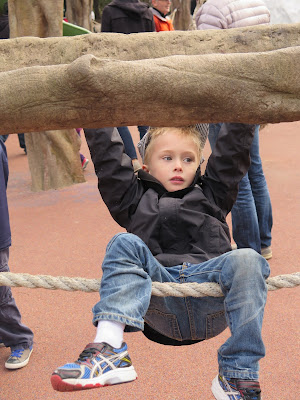 James takes to the zoo's nicely arranged playground. Here kids learn socializing skills and get exercise.