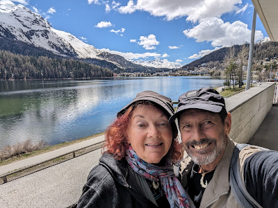 Framed by Lake St. Moritz are Christene "Cookie" Meyers and Bruce Keller, on a unique train trip from Tirano, Italy.