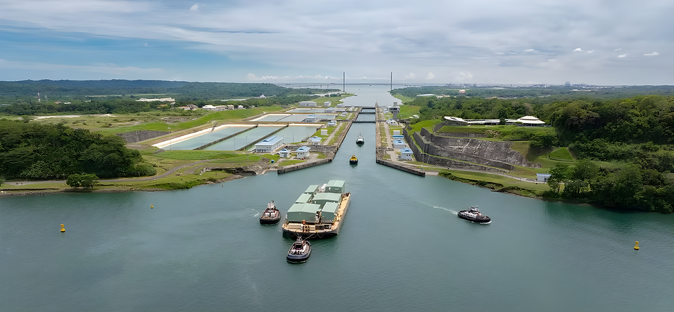 Aerial view of tugboats towing a cargo barge through a Panama Canal lock shows a distant bridge under cloudy skies