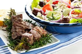 A favorite Thanksgiving meal for us on the road is lamb skewers and a Greek salad, this one in Santorini.