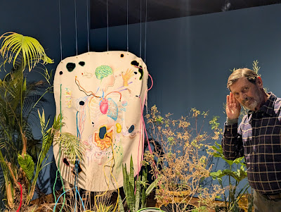Bruce Keller "listens" to this Lucia Monge installation a fascinating study of nature by the noted Peruvian artist. It includes drawings, real plants connected to a microphone.