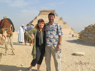 Cookie and Keller travel internationally several times a year, here at the Pyramids in Egypt. That will resume!