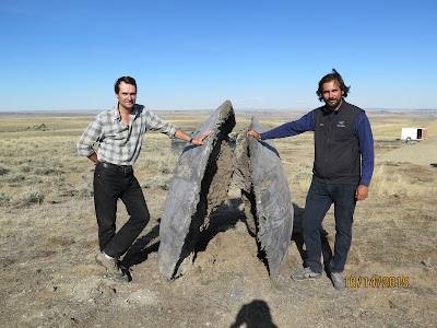 Alban Bassuet, left, and sculptor Ricardo Sanz during an early period of the design phase. A much larger piece massive in size now dwarfs humans.