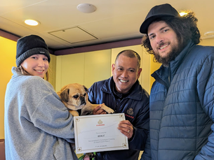Chicago couple with their dog Remly and QM2 kennel master