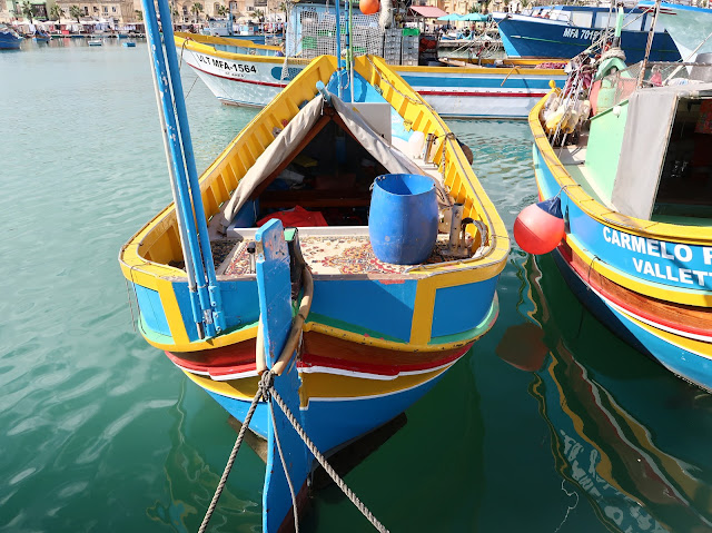 Fishing boats are brightly painted in Cinque Terre's coastal villages