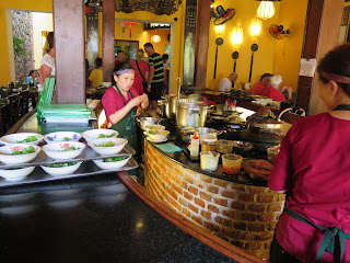 In a Vietnam restaurant, salads and soups on display for customers to choose