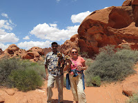 Red Rock behind them, Keller, Cookie, Nick and Nora pose