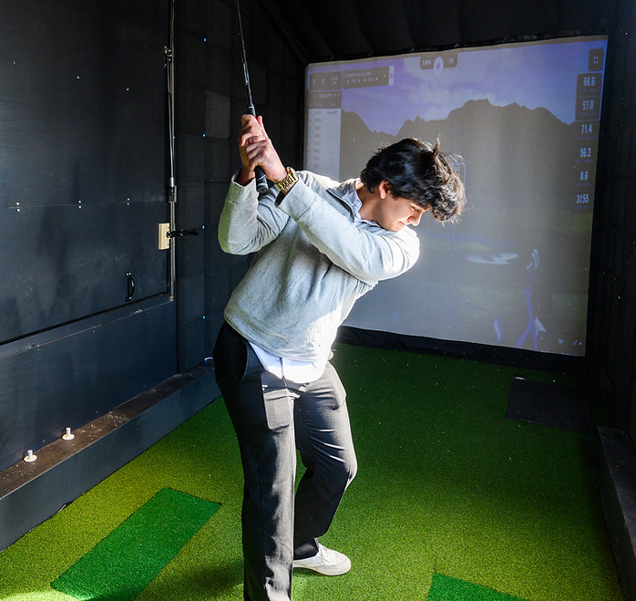 Man hitting in PowerPlay Golf Simulator Installation