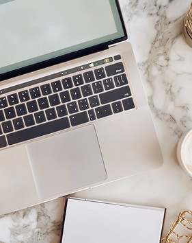 laptop-is-open-marble-countertop-with-cup-coffee-it.jpg