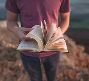 Man Holding An Open Bible