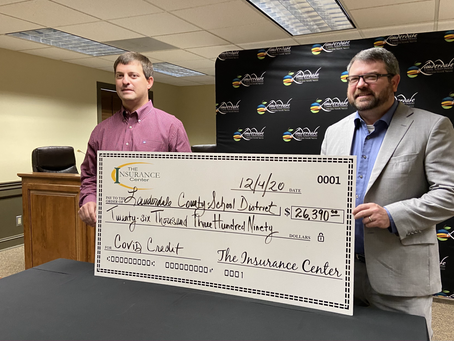Lauderdale County School District receives rebate check from insurance company