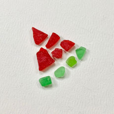 red and green seaglass in the shape of a watermelon