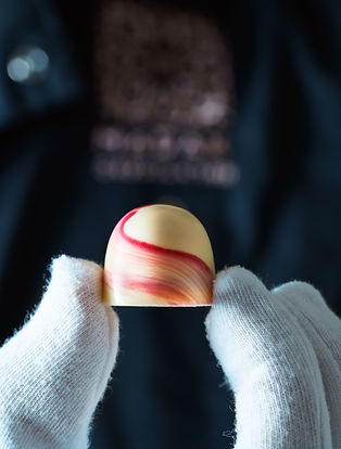 Kamile Kave - Madak - Holding chocolate in fingers.jpeg