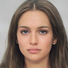 A young Caucasian woman. Long brown hair, blue eyes.